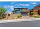 Two-story contemporary home with landscaped front yard and two-car garage at 7230 Galaxy Dune St, Las Vegas, NV 89148