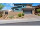 Modern two-story house with attached garage and desert landscaping at 7230 Galaxy Dune St, Las Vegas, NV 89148