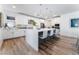 Modern kitchen with white cabinets and large island at 7230 Galaxy Dune St, Las Vegas, NV 89148