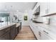 Modern kitchen with white cabinets and gas range at 7230 Galaxy Dune St, Las Vegas, NV 89148