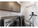 Laundry room with LG washer and dryer, cabinets, and drying rack at 7230 Galaxy Dune St, Las Vegas, NV 89148