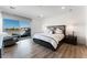 Spacious main bedroom with king-size bed and access to a private balcony at 7230 Galaxy Dune St, Las Vegas, NV 89148