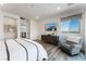 Main bedroom with a king bed, sitting area, and calming decor at 7230 Galaxy Dune St, Las Vegas, NV 89148