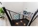 Modern staircase with dark wood and metal railings, offering an open view to the living area at 7230 Galaxy Dune St, Las Vegas, NV 89148