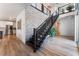 Modern open staircase with metal railing, leading to upper level at 7230 Galaxy Dune St, Las Vegas, NV 89148