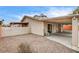 Backyard view showing gravel, a partial view of a pool, and a covered patio at 7232 Raincloud Dr, Las Vegas, NV 89145