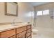 Bathroom boasts a tub, shower, and wood vanity at 7232 Raincloud Dr, Las Vegas, NV 89145