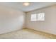 Simple bedroom with carpet and large window at 7232 Raincloud Dr, Las Vegas, NV 89145