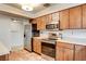 Bright kitchen with stainless steel appliances and wood cabinets at 7232 Raincloud Dr, Las Vegas, NV 89145