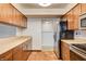 Stainless steel appliances and light wood cabinets in kitchen at 7232 Raincloud Dr, Las Vegas, NV 89145