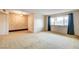 Bright living room featuring carpeted floors and textured wall at 7232 Raincloud Dr, Las Vegas, NV 89145