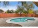 Landscaped pool area with a kidney-shaped pool at 7232 Raincloud Dr, Las Vegas, NV 89145