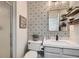 Modern bathroom with a tile accent wall at 7528 Stray Horse Ave, Las Vegas, NV 89113