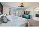 Spacious main bedroom with a television and adjoining bathroom at 7528 Stray Horse Ave, Las Vegas, NV 89113