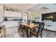 Casual dining area with farmhouse table and view into living room at 7528 Stray Horse Ave, Las Vegas, NV 89113