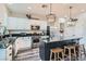 Well-lit kitchen featuring granite counters, stainless steel appliances and wood floors at 7528 Stray Horse Ave, Las Vegas, NV 89113