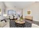 Inviting living room featuring wood floors, stylish furniture and neutral paint at 7528 Stray Horse Ave, Las Vegas, NV 89113