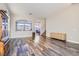 Bright living room featuring wood floors, stylish furniture and neutral paint at 7528 Stray Horse Ave, Las Vegas, NV 89113