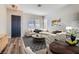 Inviting living room featuring wood floors, stylish furniture and neutral paint at 7528 Stray Horse Ave, Las Vegas, NV 89113