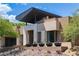 Modern home with sleek design, stone accents, and landscaped grounds at 78 Hawk Ridge Dr, Las Vegas, NV 89135