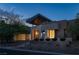 Modern home with sleek design, stone accents, and landscaped grounds at 78 Hawk Ridge Dr, Las Vegas, NV 89135