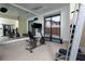 Well-equipped home gym featuring exercise machines and a mirrored wall at 78 Hawk Ridge Dr, Las Vegas, NV 89135