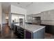 Modern kitchen with stainless steel appliances and granite island at 78 Hawk Ridge Dr, Las Vegas, NV 89135