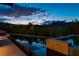 Luxury pool and spa with mountain views at dusk at 78 Hawk Ridge Dr, Las Vegas, NV 89135