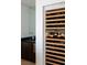 Built-in wine cellar with numerous bottles at 78 Hawk Ridge Dr, Las Vegas, NV 89135