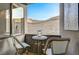 Private balcony with mountain views and bistro seating at 821 Barrhead Ave, Henderson, NV 89012