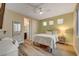 Cozy bedroom with light walls and ceiling fan at 821 Barrhead Ave, Henderson, NV 89012