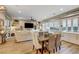 Bright dining area with a wood table and chairs, overlooking the living room at 821 Barrhead Ave, Henderson, NV 89012