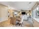 Open dining area with rustic farmhouse table and chairs near living space at 821 Barrhead Ave, Henderson, NV 89012