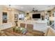 Dining area with rustic wood table and chairs, adjacent to living room at 821 Barrhead Ave, Henderson, NV 89012