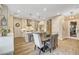 Bright kitchen with white cabinets, center island, and stainless steel appliances at 821 Barrhead Ave, Henderson, NV 89012