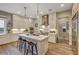 Spacious kitchen with island, stainless steel appliances, and white cabinetry at 821 Barrhead Ave, Henderson, NV 89012