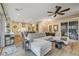 Spacious living room with L-shaped sectional sofa, built-in shelving, and hardwood floors at 821 Barrhead Ave, Henderson, NV 89012