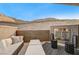 Spacious patio features a fireplace and comfortable seating with mountain views at 821 Barrhead Ave, Henderson, NV 89012