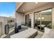 Relaxing outdoor patio with fireplace and seating area, offering mountain views at 821 Barrhead Ave, Henderson, NV 89012