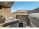 Private patio with fireplace, seating, and stunning mountain views at 821 Barrhead Ave, Henderson, NV 89012