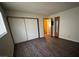 Bedroom featuring wood-look flooring, a window and closet at 855 Del Rey Dr, Boulder City, NV 89005