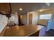 Kitchen with wooden cabinets, dual basin sink and breakfast bar at 855 Del Rey Dr, Boulder City, NV 89005