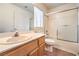 Bright bathroom features a single sink vanity and a shower-tub combo with sliding glass doors at 86 Myrtle Beach Dr, Henderson, NV 89074