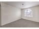 Well-lit bedroom featuring an arched window and neutral walls at 86 Myrtle Beach Dr, Henderson, NV 89074