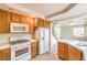 White appliances and light wood cabinets in this bright kitchen at 86 Myrtle Beach Dr, Henderson, NV 89074