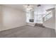 Carpeted living room featuring a modern fireplace, high ceilings and an open floor plan at 86 Myrtle Beach Dr, Henderson, NV 89074