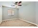 Bright bedroom with ceiling fan and neutral decor at 8658 Tom Noon Ave # 103, Las Vegas, NV 89178