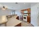 Kitchen with light countertops, wood cabinets, and appliances at 8658 Tom Noon Ave # 103, Las Vegas, NV 89178