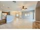 Open floor plan with kitchen island and tile floors at 8658 Tom Noon Ave # 103, Las Vegas, NV 89178