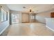 Spacious living room with tile floors and sliding glass door at 8658 Tom Noon Ave # 103, Las Vegas, NV 89178